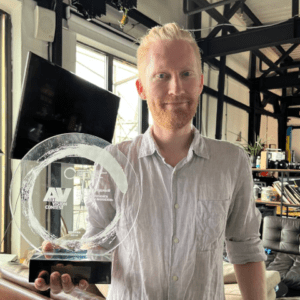 Nikolay holding the Award Art Vision
