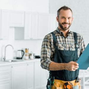 Plumber holding clipboard