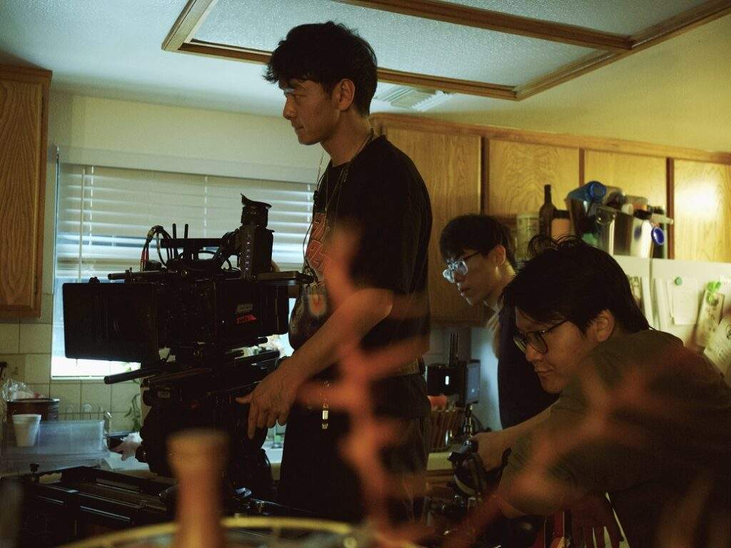 Yifu working on set of, with 1st AC Ziyue Alex Hu and Dolly Grip Zhen Donny Li, Photo credit- Zhiyan Li